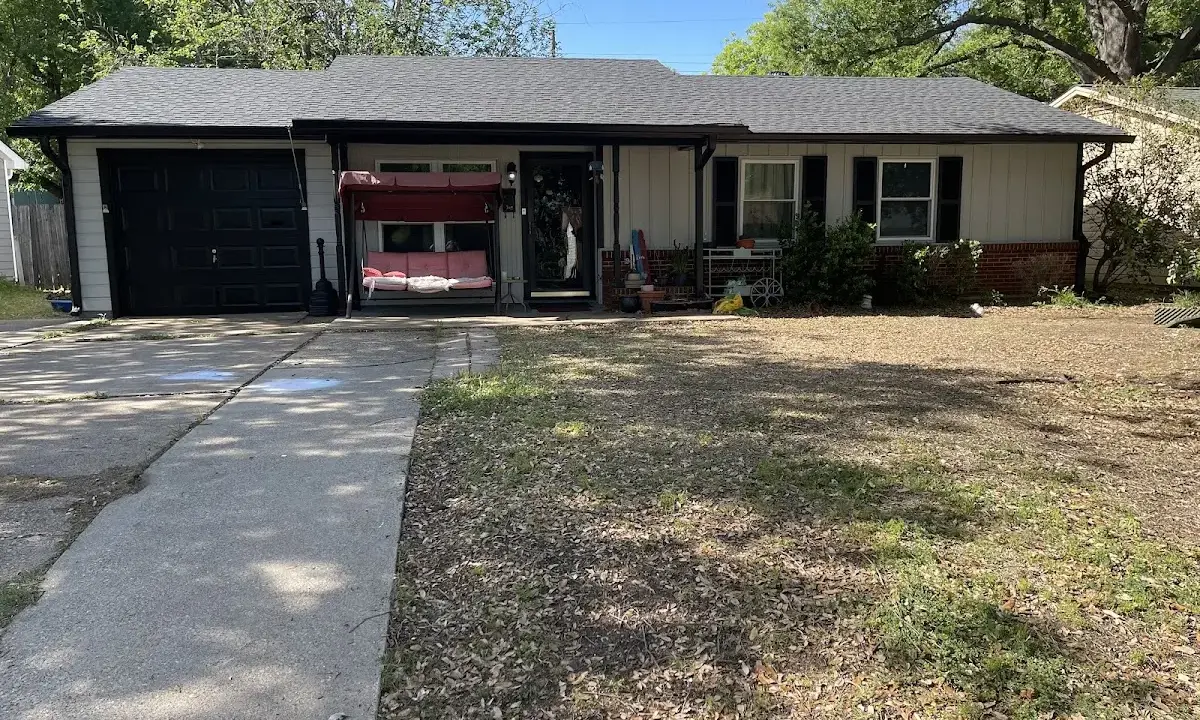 Asphalt Shingle Roof Repair crew at work on a residential roof in Tarpon Springs